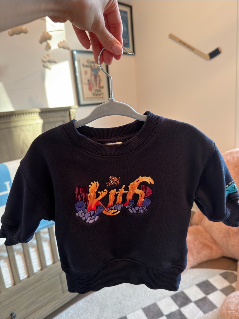 Kith Kids Black Sweatshirt with Vibrant Coral Graphic